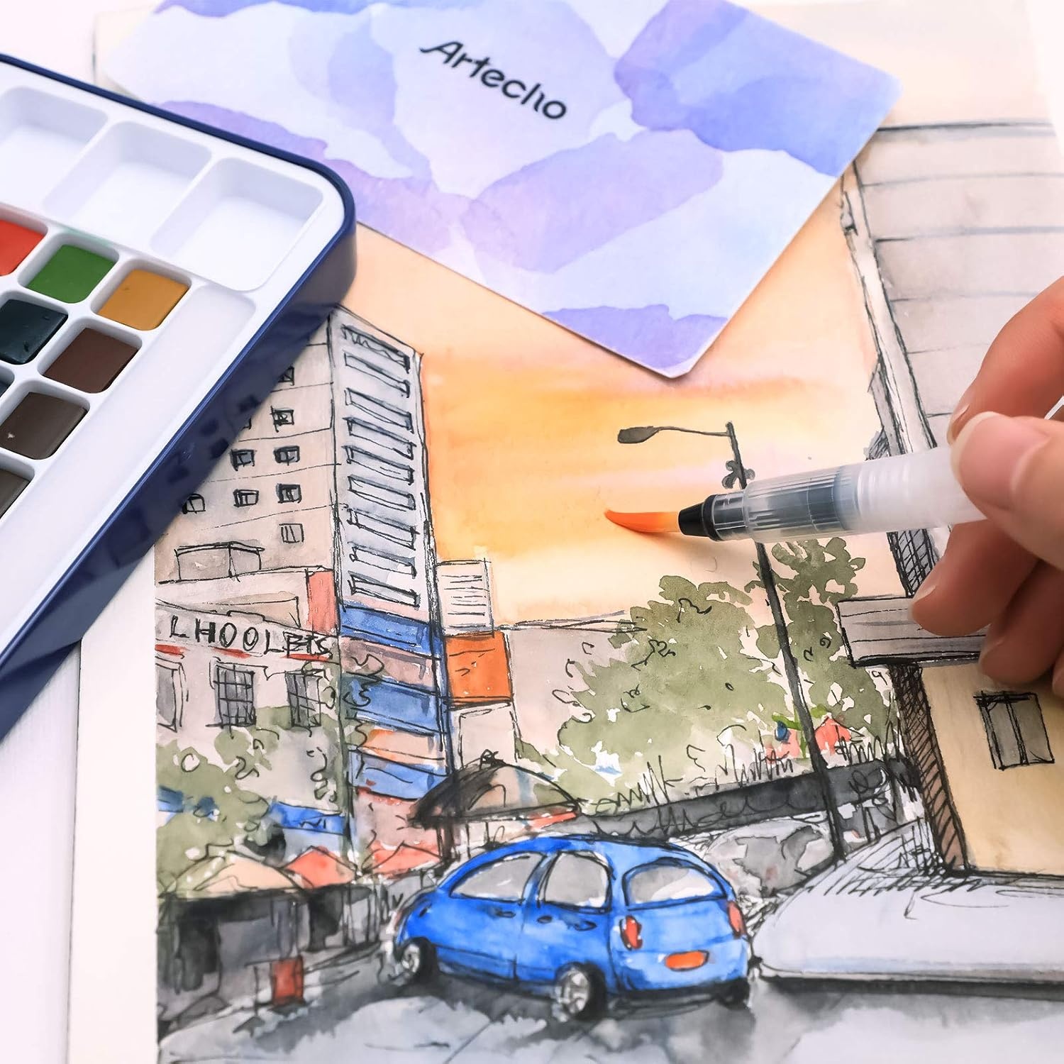 image:imageArtecho 24 Colors Watercolor Paint Set Portable Travel Tin Box with Brush  Watercolor Paper Color Chart amp Sponge Included  Lightweight Metal Case  Creative Gift for Artists Students Beginners18 colors