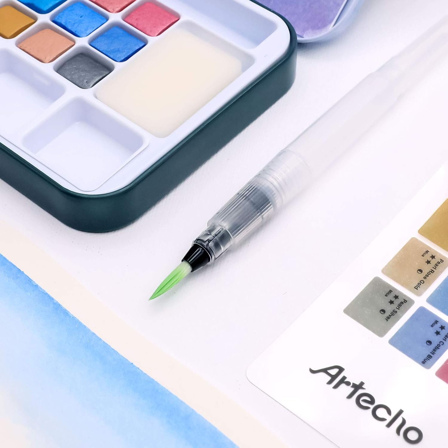 image:imageArtecho 24 Colors Watercolor Paint Set Portable Travel Tin Box with Brush  Watercolor Paper Color Chart amp Sponge Included  Lightweight Metal Case  Creative Gift for Artists Students Beginners18 metallic colors